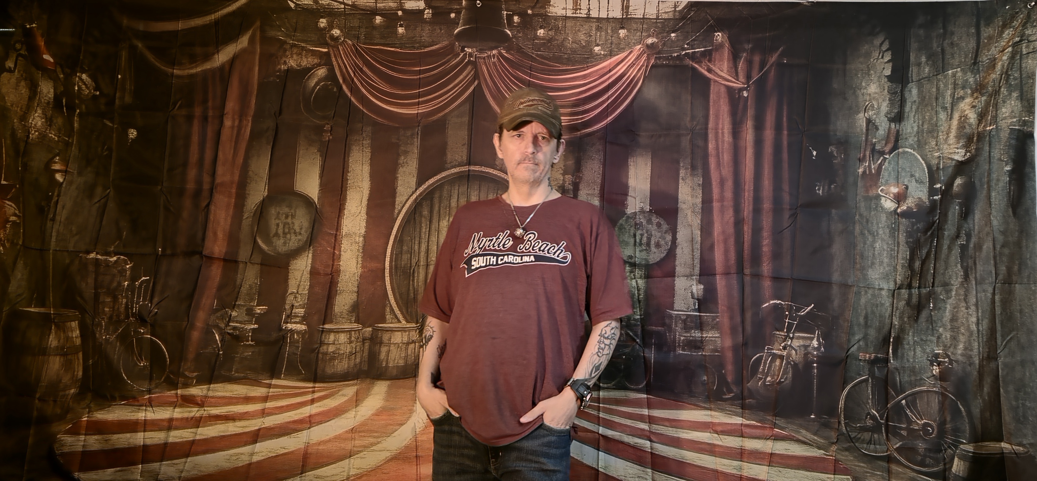 Guest posing with a storybook-style backdrop